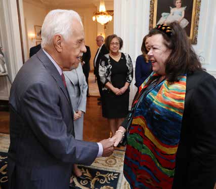 Governor wilder shaking hands with dame karen