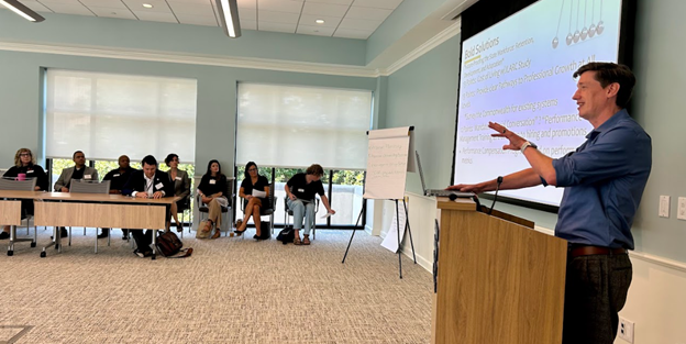 Jason Burkett, Senior Consultant at the Wilder School’s Center for Public Policy, engages with state agency leaders during a discussion on collaborative solutions to shared challenges.